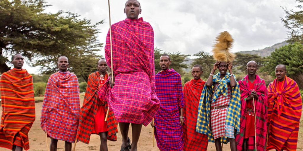 Maasai people dancing to a traditional song