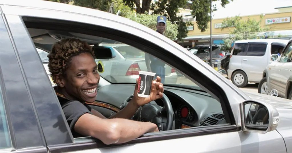 Eric Omondi driving one of his cars