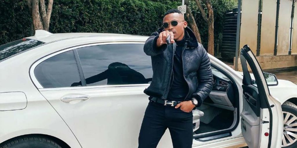 Otile standing outside his White Mercedes Benz  SRC: @Biggest Kaka 